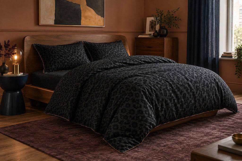 Noir Obsidian duvet set on a wooden bed