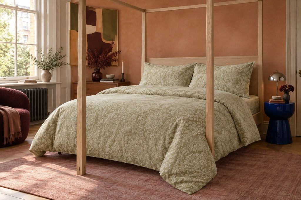 Olive Heritage duvet set on a wooden bed
